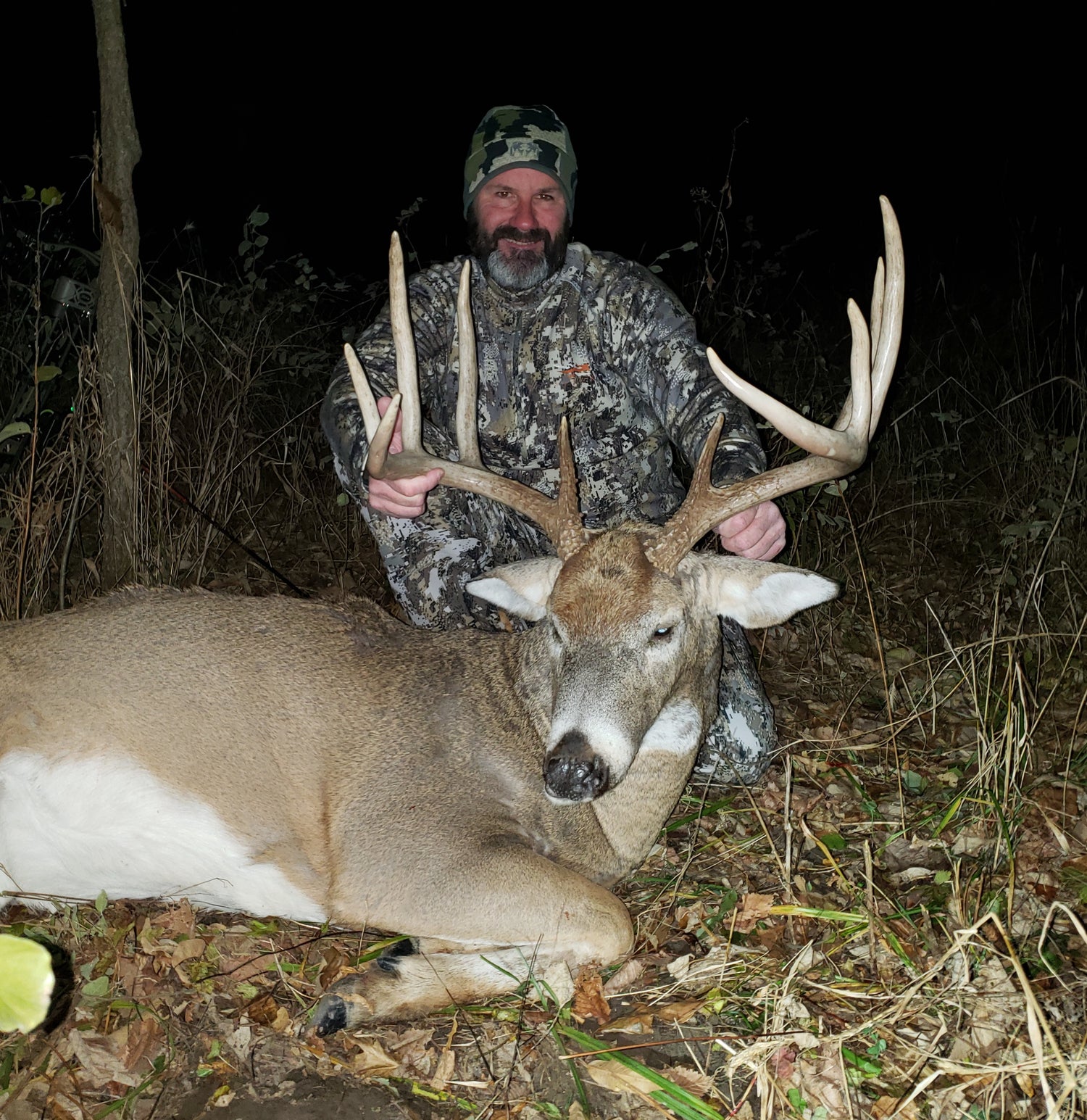 Chuck Main showcasing deer harvested through property management and habitat planning