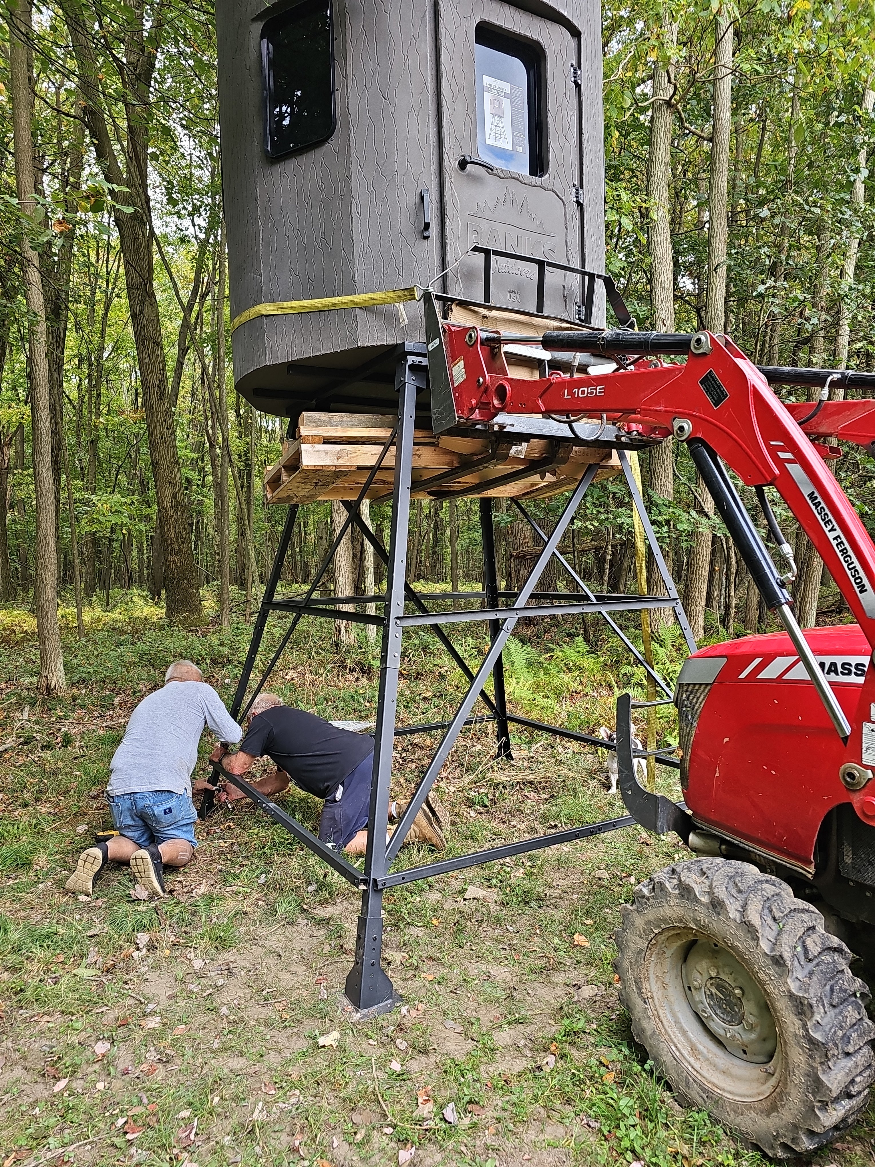 Banks Outdoors hunting blind being installed with heavy equipment on hunting property