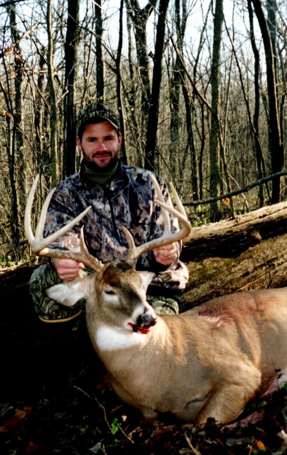 Chuck Main with mature whitetail bucks harvested on managed hunting properties