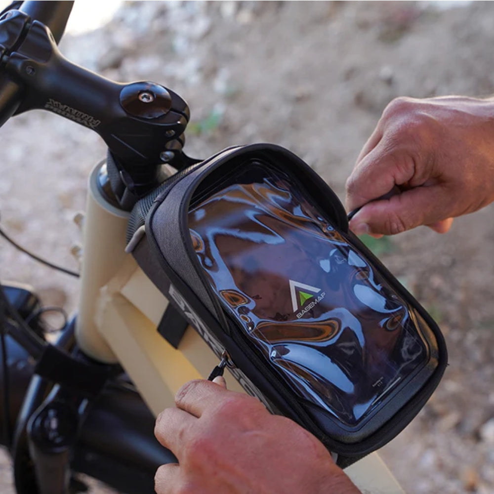 Front view of the Bakcou Phone Bag featuring a clear touchscreen-compatible pouch and durable, weather-resistant construction