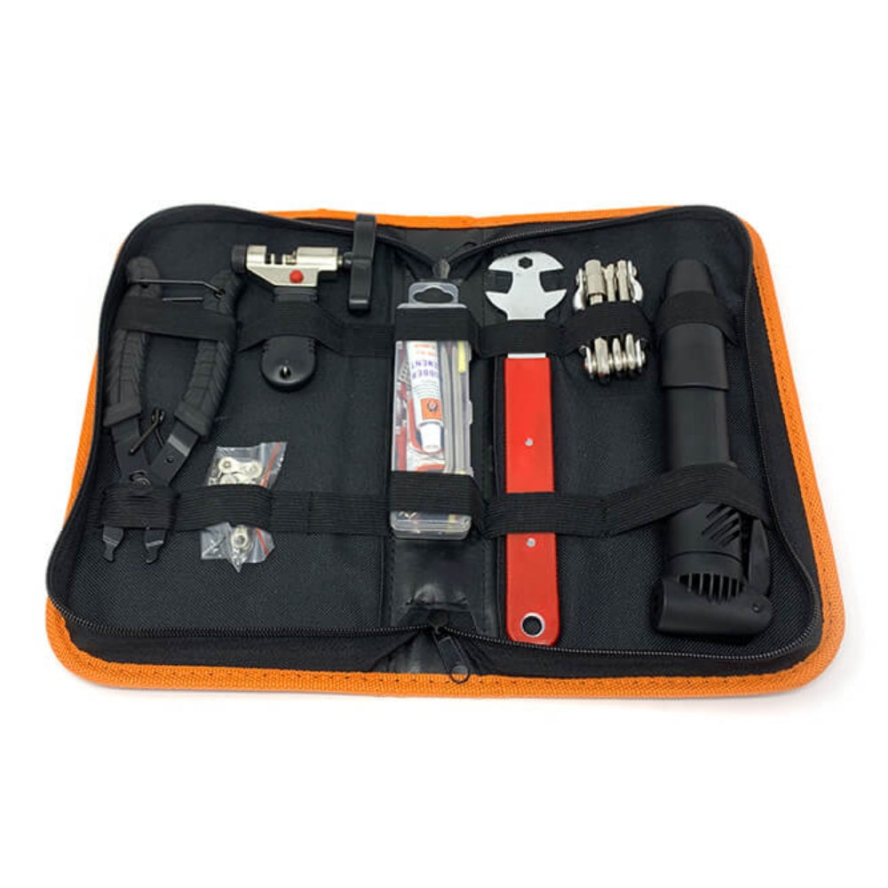 Bakcou Trailside Repair Kit open, revealing organized compartments for tools, including a chain tool, multi-tool, tire patch kit, and bike pump