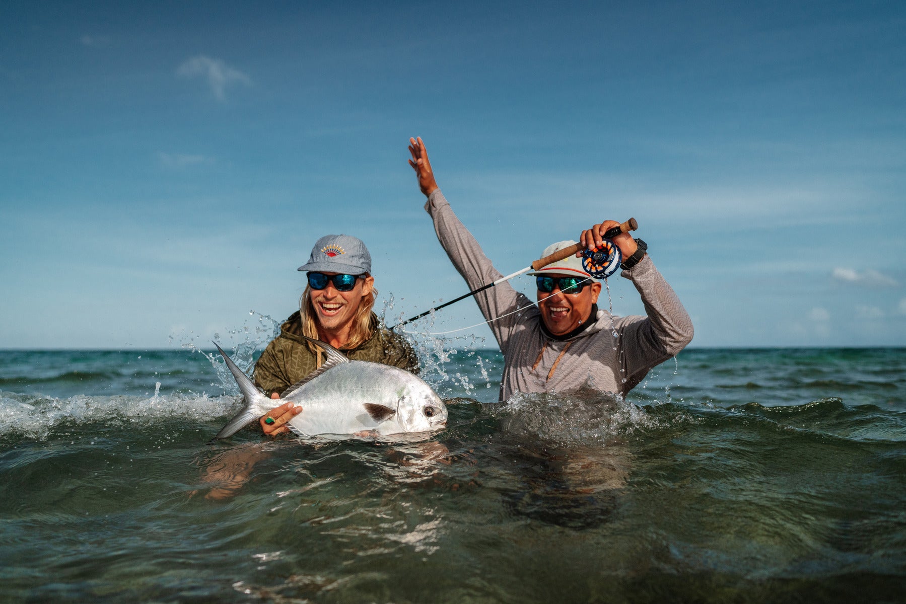 Two men fishing in the ocean wearing new styles of Bajio fishing sunglasses
