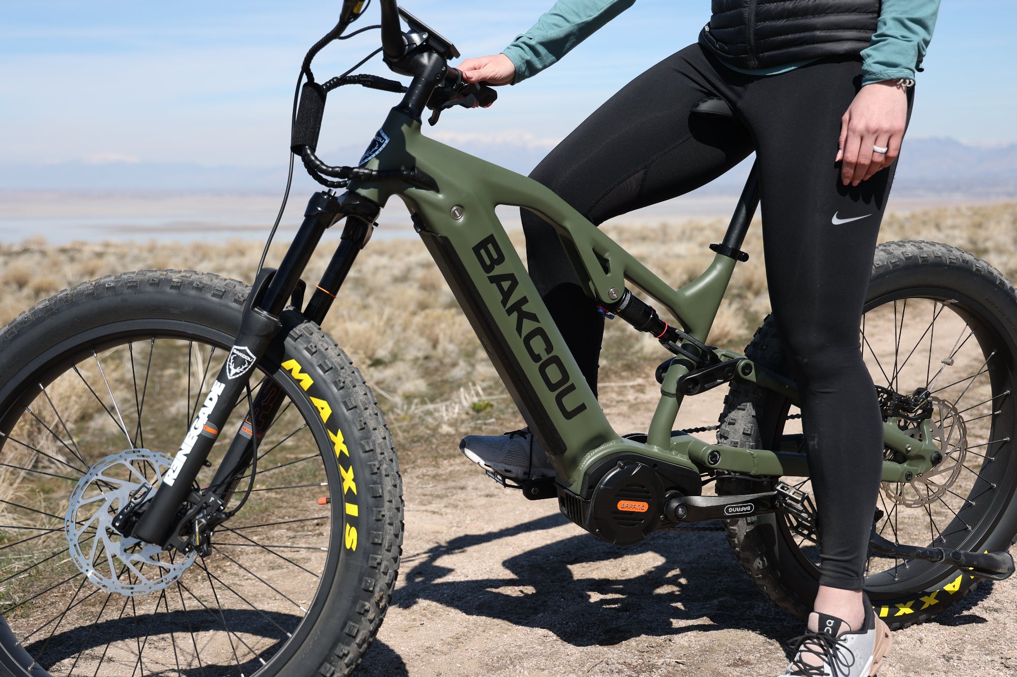 Bakcou Scout E-Bike in Matte Army Green, Close up angle view with woman