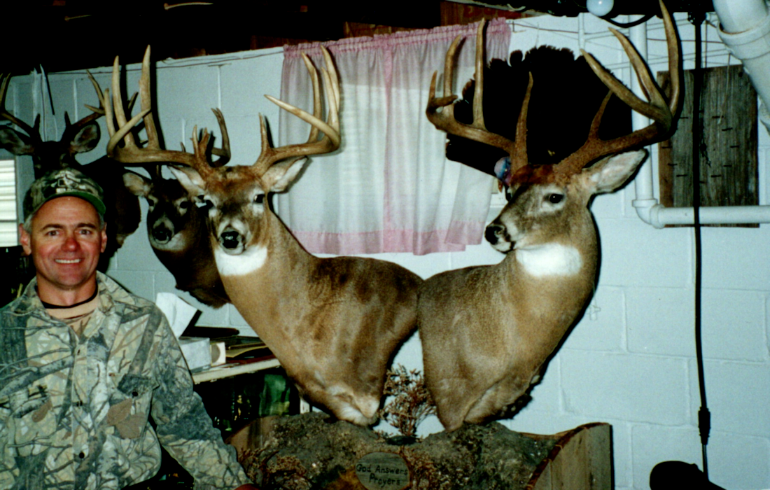 Pair of mounted trophy bucks showcasing results of strategic land and herd management